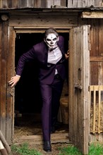 Male daemon comming out of barn. Face painting art