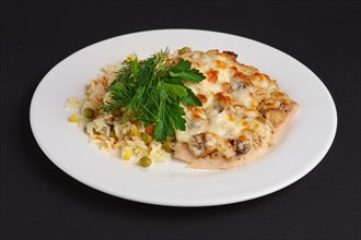 Chicken fillet with mushrooms and cheese garnished with rice
