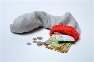 Banknotes in woollen sock