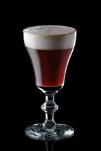 Glass of espresso martini isolated on black background background