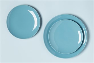 Flat lay blue plates arrangement