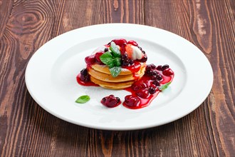 American pancakes with strawberry and black currant jam