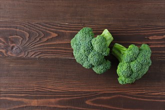 Broccoli on dark wooden background