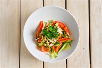 Top view of salad with fresh tomato