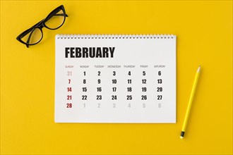Flat lay planner calendar yellow background