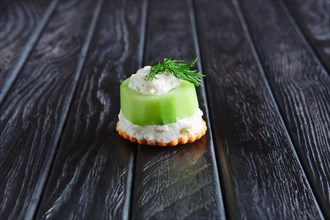 Appetizer for reception. Kiwi stuffed with cream cheese