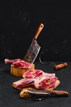 Fresh raw lamb ram shank in the process of cutting photo with full depth of field