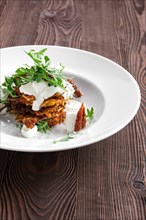 Pumpkin fritters with soft cheese and sun-dried tomato