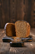 Loaf of artisan rye bread cut on half