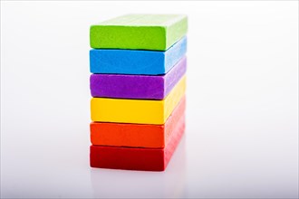Colorful Domino Blocks in a line on a white background