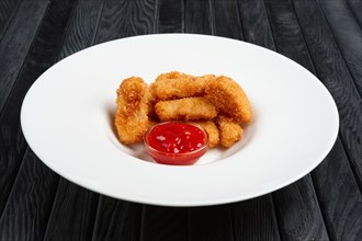 Deep fried chicken nuggets on a plate