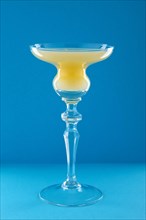 Old Cuban cocktail on blue background