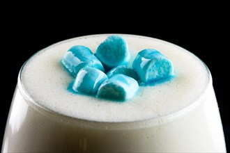 Macro photo of cappuccino with marshmallows topping.