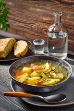 Red salmon fish soup with potato and carrot