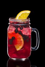 Cocktail with black currant and vodka in mason jar mug isolated on black