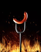 Grill or barbecue cookout concept. Bangers sausage on fork over the fire on black background
