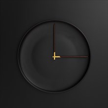 Dark plate with chocolate sticks form clock