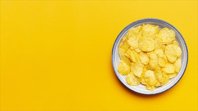 Top view chips bowl yellow background. Resolution and high quality beautiful photo