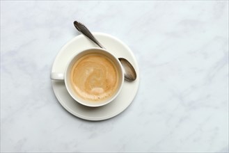 Cup with coffee and spoon