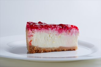 Portion of cherry cheesecake on a plate