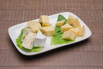Plate with three kinds of cheese. Cheeseboard