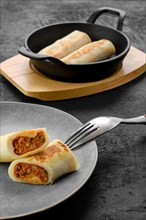 Thin pancakes stuffed with rabbit meat