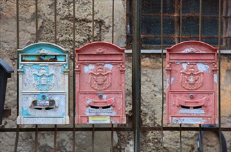 Colourful old mailboxes