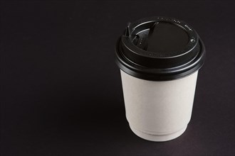 Cardboard cup with lid. Place for text