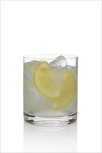 Cocktail martini and tonic with lemon and ice isolated on white