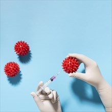 Top view hand holding virus with syringe. Resolution and high quality beautiful photo