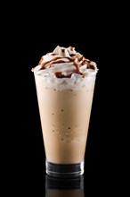 Caramel milkshake isolated on black background