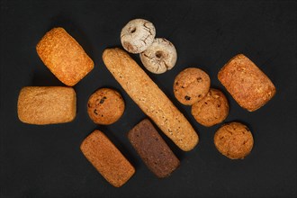 Top view of assortment of artisan bread made of different types of grain with different shapes