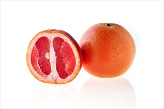 Fresh red grapefruit isolated on white background
