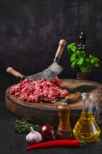 Fresh beef minced meat on wooden chopping stump