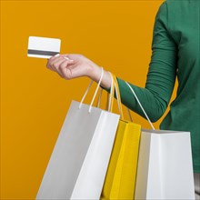 Woman holding credit card many shopping bags. Resolution and high quality beautiful photo