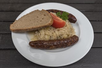 Bratwurst with sauerkraut and bread