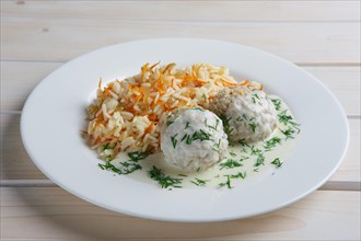 Plate with meatballs with rice and carrot