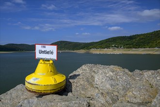 Dry buoy at low water in Lake Edersee