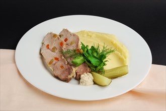 Cold boiled pork with potato puree and pickled cucumber