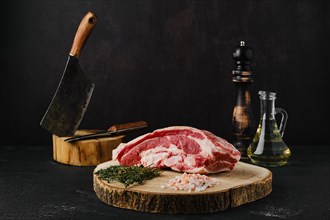 Raw beef brisket on wooden cutting board