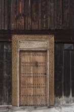 Carved entrance door of a carpenter's workshop