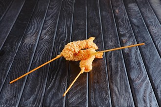 Appetizer for reception. Deep-fried shrimp on skewer