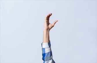Hand gesturing the letter C in sign language on isolated background. Man hand gesturing letter C of alphabet isolated. Letters of the alphabet in sign language