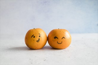 Tangerines with funny faces. Resolution and high quality beautiful photo