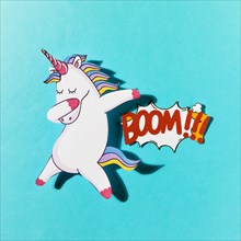 White dabbing unicorn with boom comic text blue backdrop. Resolution and high quality beautiful photo