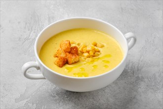 Mashed corn soup puree with croutons