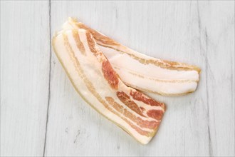 Top view of two slices of bacon on the table