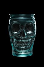 Goblet skull for Halloween cocktail or drink. Green color matt glass cup in the shape of skull