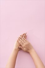 Woman showing her manicure on pink background. Resolution and high quality beautiful photo