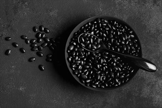 Flat lay arrangement black beans dark background